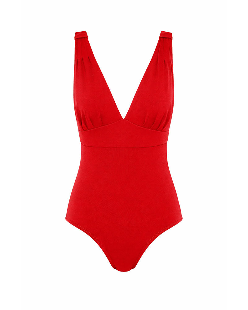 Women's red swimsuit with a deep neckline and full coverage on a white background