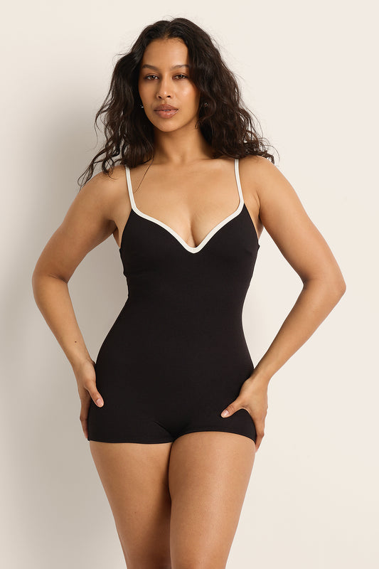 Front view of the Fearless au Grace Boyleg in Matte Black, a supportive one-piece swimsuit with boyleg cut and crinkle fabric