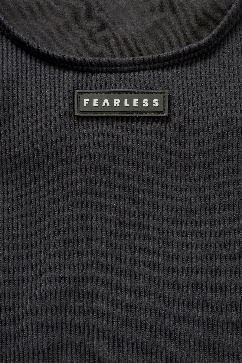 Close-up of Fearless au ribbed fabric in All Black - used in the Adventure Suit, designed to withstand ocean swims and pool laps