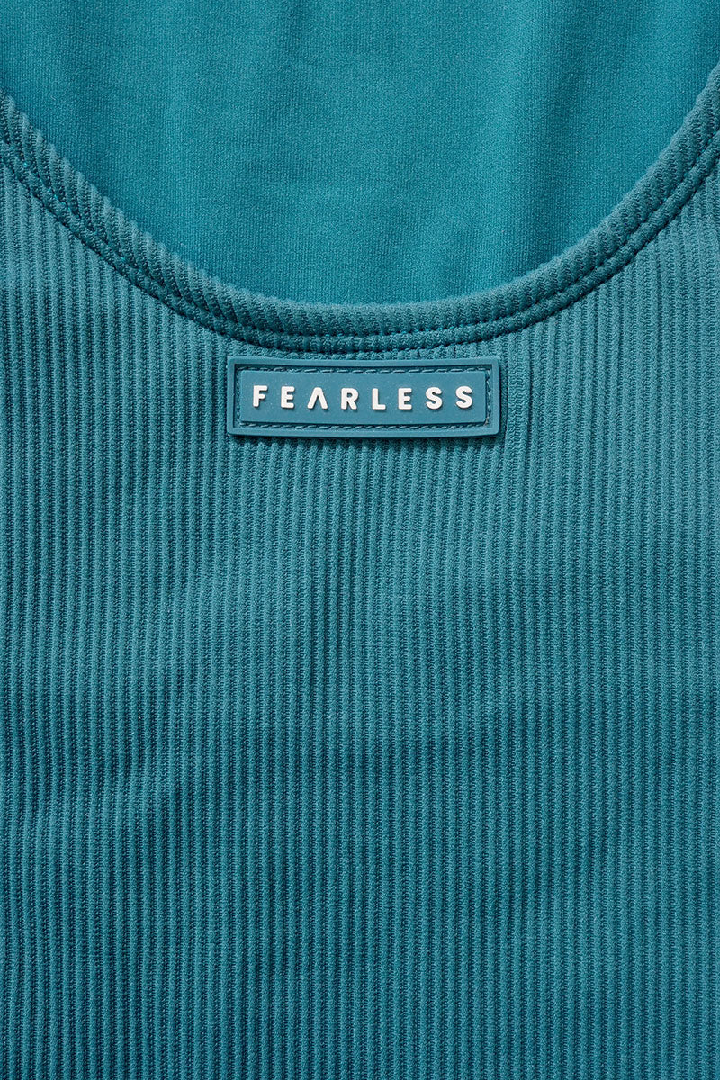 Fearless premium luxe ribbed fabric in teal. Fearless logo. Fearless swimwear is designed to withstand ocean swims, pool laps and long summer days - not stretch out after a handful of wears.