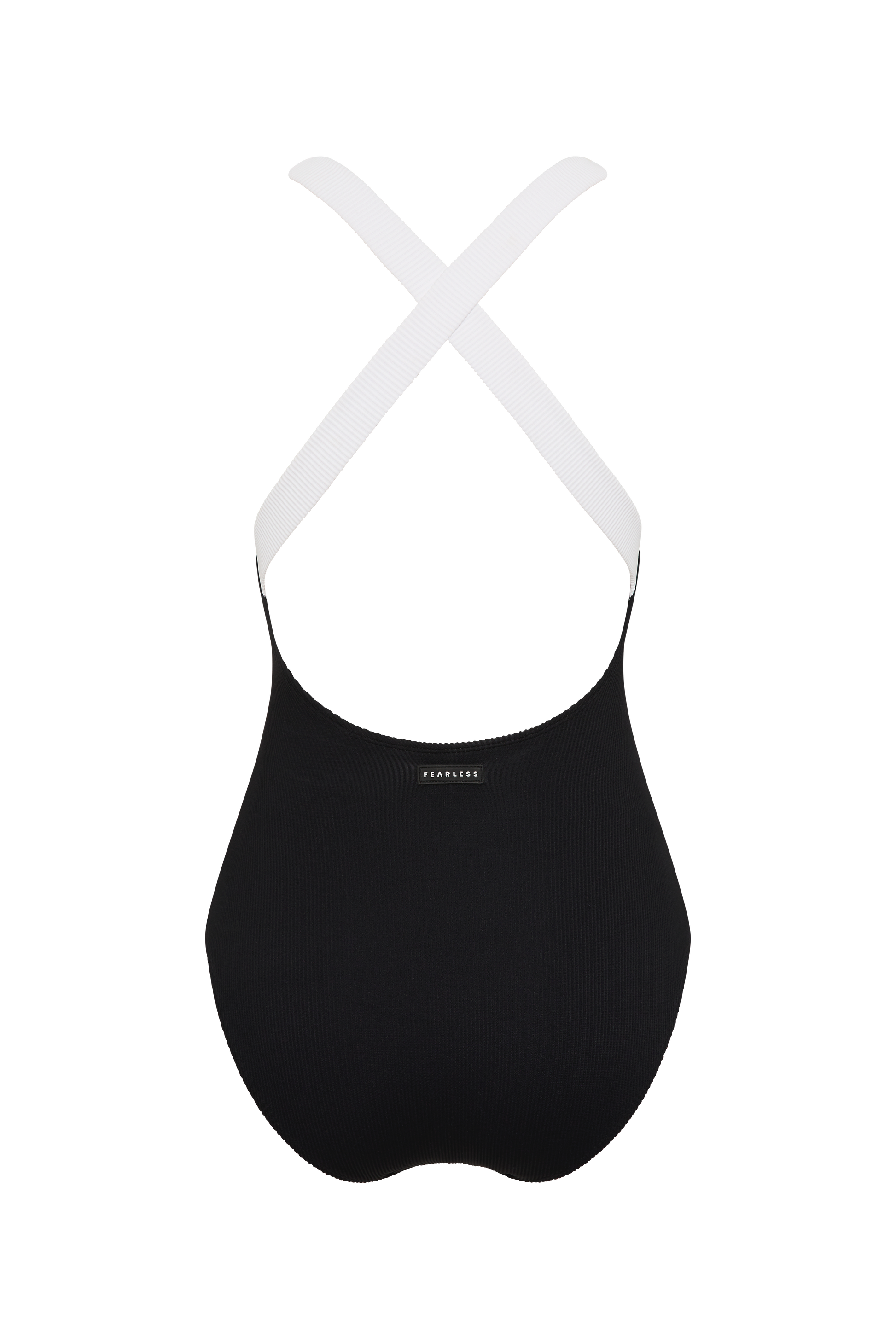 The Fearless au Adventure Suit Long Torso is a black sports bra with thick white elastic cross-back straps and a built-in shelf bra. A small logo label appears at the center back, shown against a plain white background.