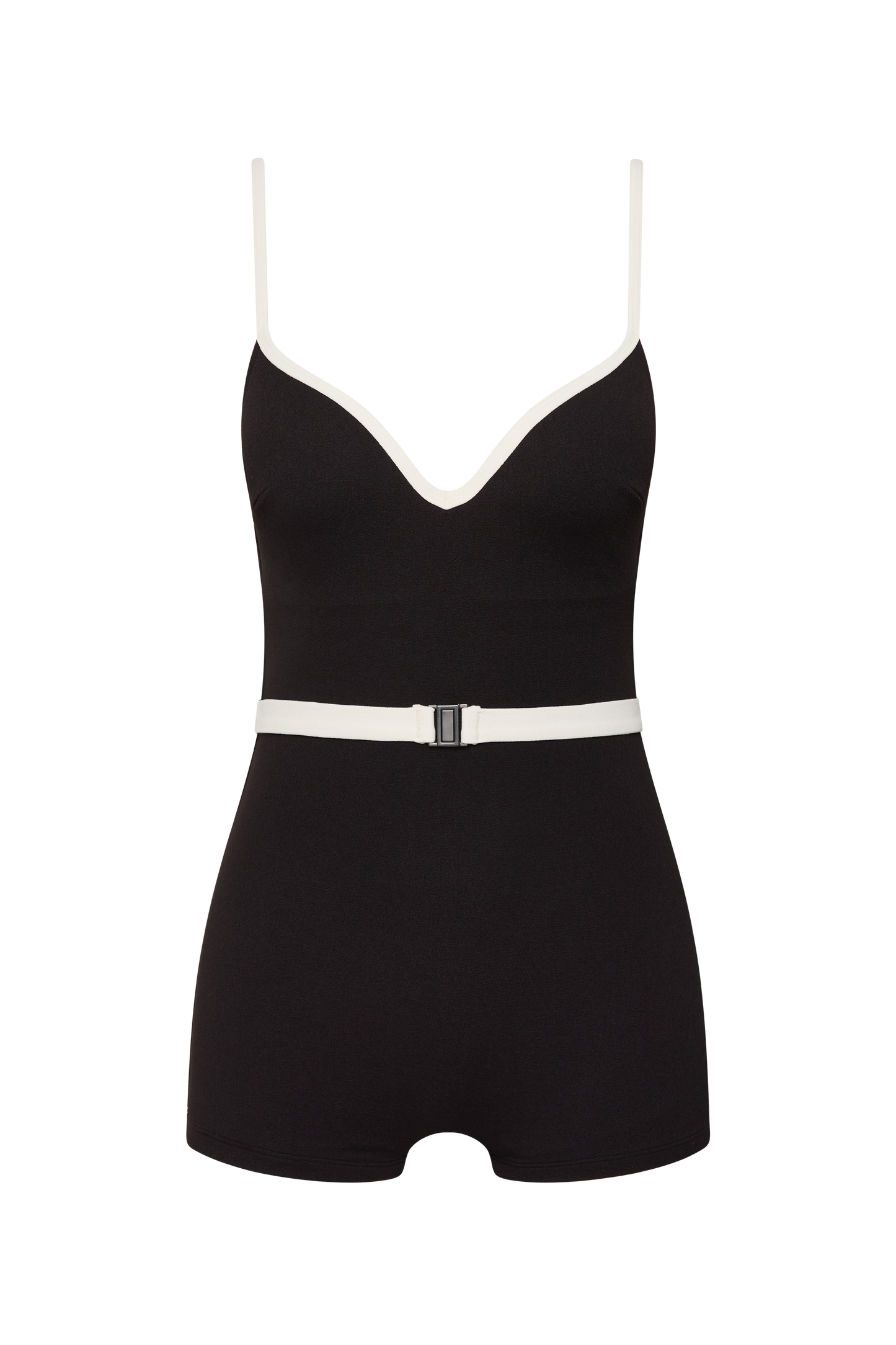 The Grace Boyleg by Fearless au is a matte black one-piece bodysuit made from recycled crinkle fabric, featuring white trim, thin white straps, a V-neckline, a white belt with black buckle, and a comfortable short boyleg cut.