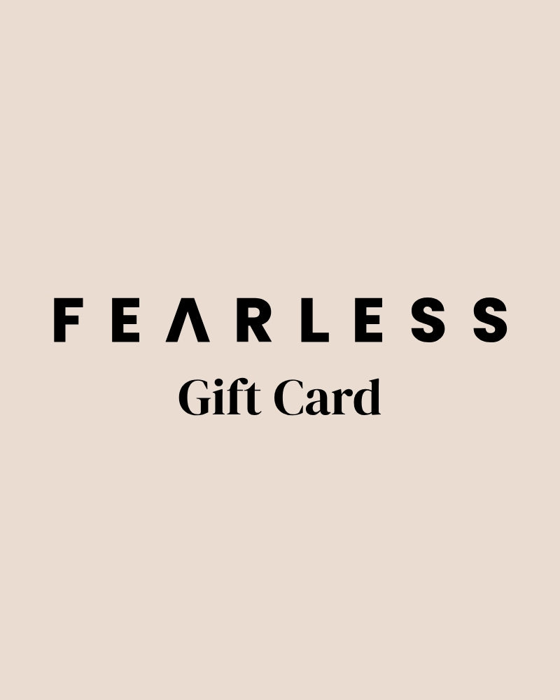 Beige background with bold black text reading FEARLESS in all caps, with an inverted A. Below, in a serif font, it says Gift Card.