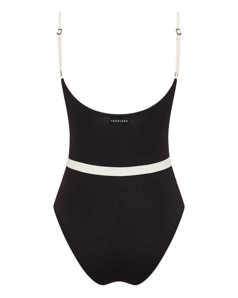 A black one-piece swimsuit with adjustable white shoulder straps, a white horizontal band around the waist, and the word FEARLESS printed in small white letters on the upper back.