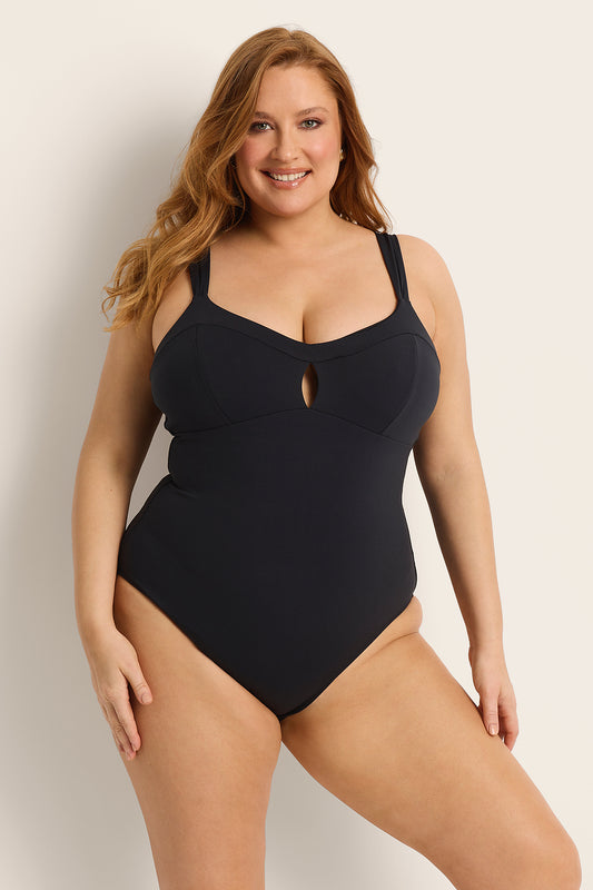 Front view of the Fearless au Magic Suit in Matte Black, a supportive one-piece swimsuit with wide shoulder straps and ruched sides
