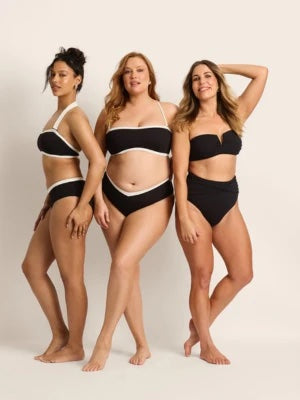 Three models in black bikinis in studio