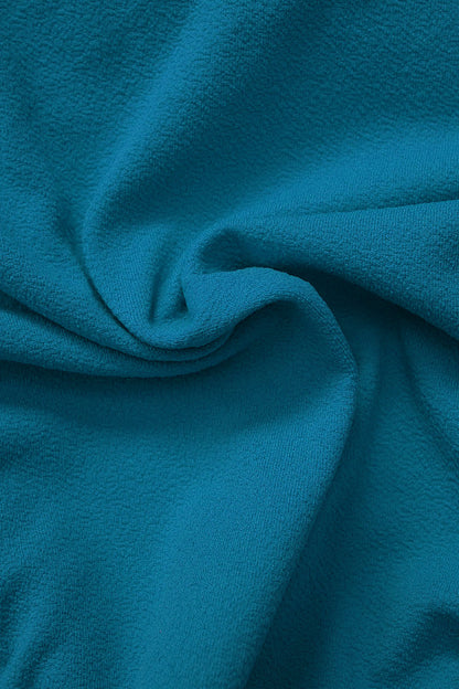 Close-up of Fearless au smooth fabric in Teal - used in the Icon Bikini Top, designed to withstand ocean swims and pool laps