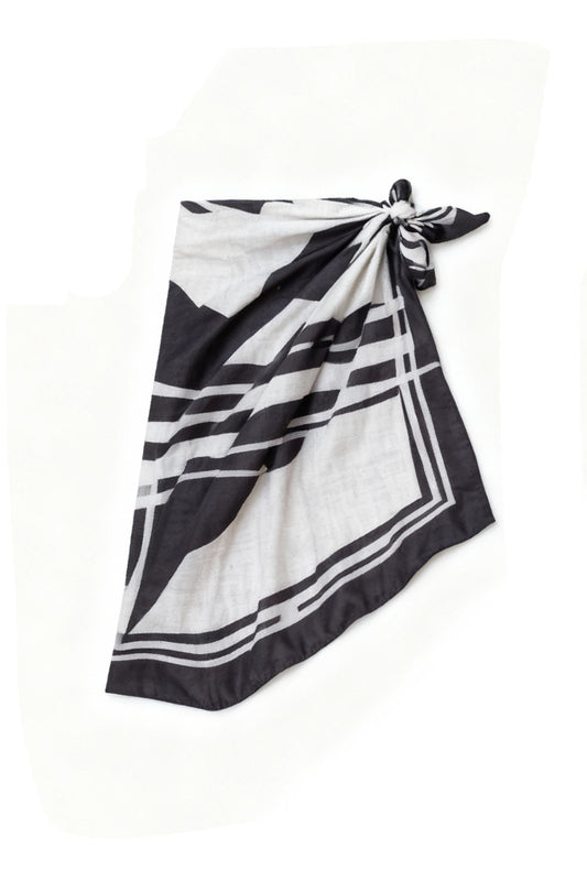 Geo Print Sarong by Fearless au features abstract black and white geometric artwork with bold intersecting lines, a rectangular border, tied at the right side.