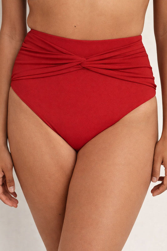 Red high-waisted bikini bottom on a neutral background