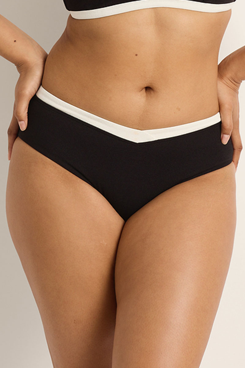 Black high-waisted bikini bottom with white waistband on a neutral background