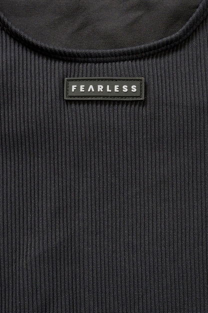 Close-up of Fearless au ribbed fabric in All Black - used in the Adventure Suit, designed to withstand ocean swims and pool laps