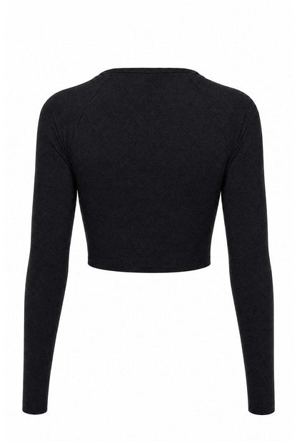 Black long-sleeve crop top on a white background