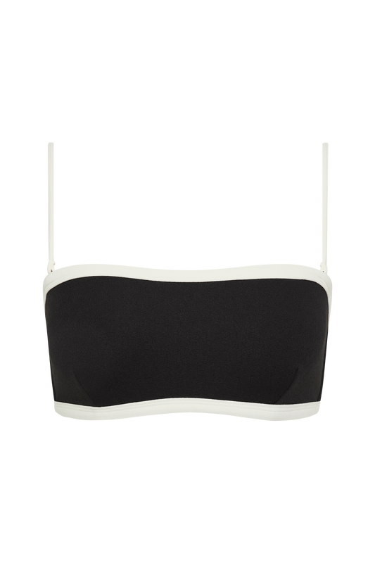 The Fearless au Nova Bikini Top is a black convertible bandeau with thin white adjustable straps and white trim, designed for A–D cup sizes. Shown against a plain white background, it’s ideal swimwear for style and support.