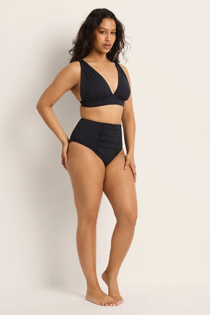 Fearless au All Day Bikini Bottom in Matte Black worn by a model - bikini bottom with high-waisted and full-coverage
