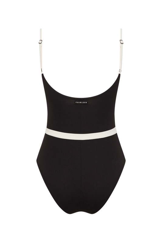 The Fearless au Grace High Rise - Matte Black / Standard is a black one-piece swimsuit with white adjustable straps, a white waist band, and a flattering high-cut leg, shown against a plain white background.