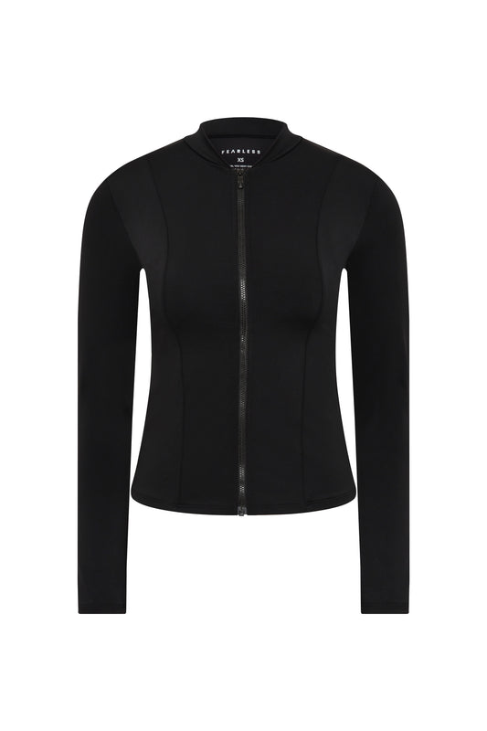 The Fearless au Long Rashie is a black, long-sleeve fitted jacket with a front zipper and small collar, offering UPF 50+ sun protection. Shown on a plain white background.