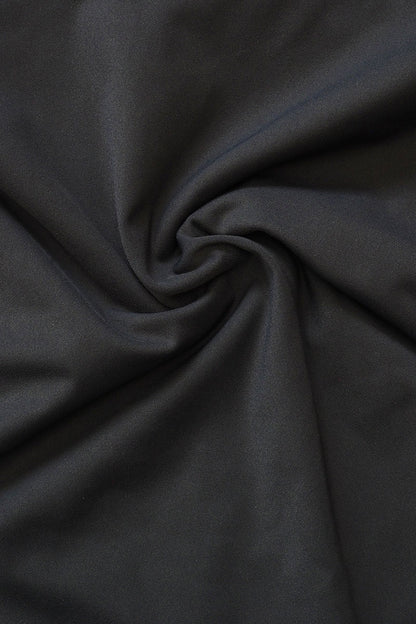 Close-up of Fearless au smooth fabric in Matte Black - used in the Freedom One Piece, designed to withstand ocean swims and pool laps