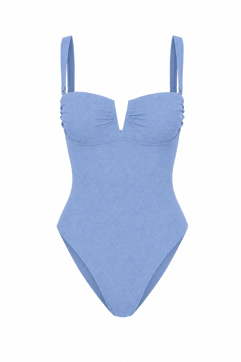 A light blue one-piece swimsuit with a sweetheart neckline, gathered bust, and thin shoulder straps, shown against a plain white background.