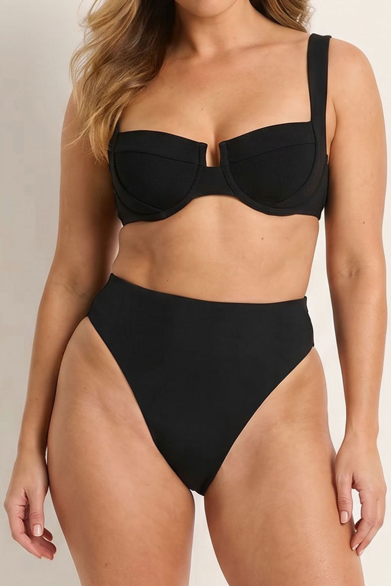 Black bikini set worn by a model on a neutral background