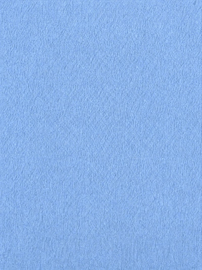 A close-up texture shot of a light blue fabric or material surface.