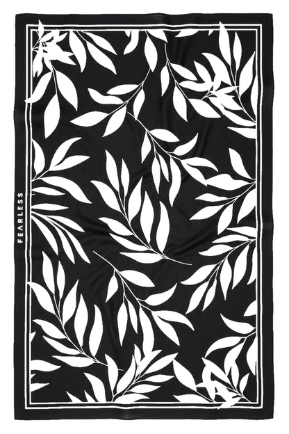 Woman wearing Fearless au Floral Print Sarong sarong in Black and White, highlighting wrap-style