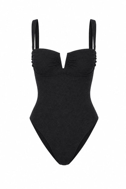 Black swimsuit with thin straps on a white background
