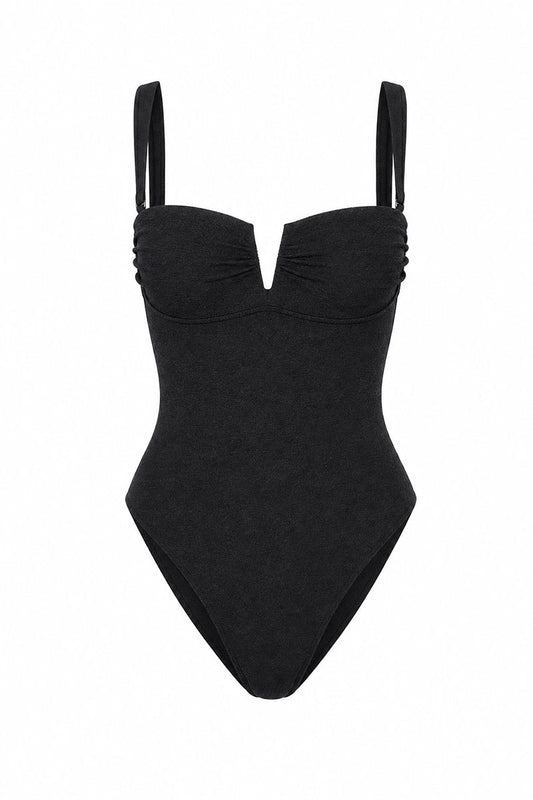 Black swimsuit with thin straps on a white background
