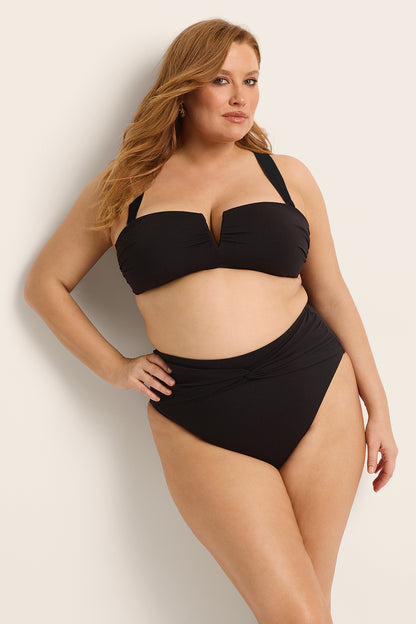 Fearless au Icon Bikini Top in Black with white trim - bikini top featuring strapless underwire, worn by a model