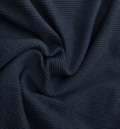 A close-up of dark navy ribbed fabric, showing the texture and folds of the material.